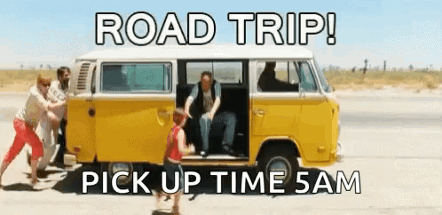 A Group Of People Pushing A Yellow Van Down A Road With The Words Road Trip Pick Up Time 5Am GIF