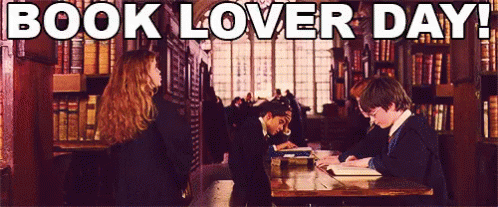 A Group Of People Reading Books In A Library With The Words Book Lover Day Below Them GIF