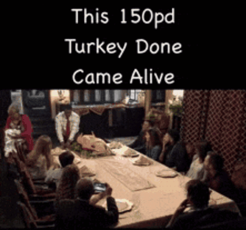 A Group Of People Sitting Around A Table With A Sign That Says This 150Pd Turkey Done Came Alive GIF