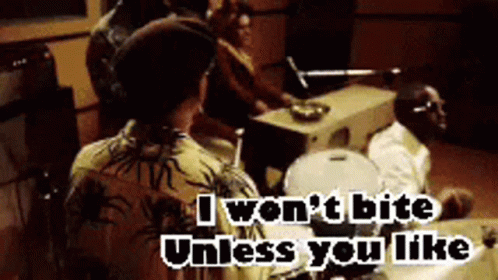 A Group Of People Sitting Around A Table With The Words " I Won T Bite Unless You Like " On The Bottom GIF