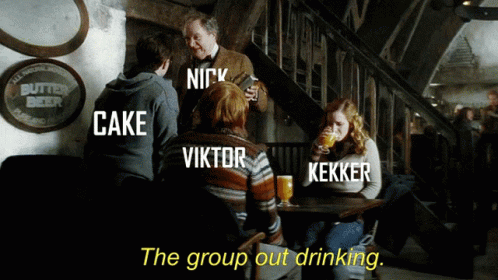 A Group Of People Sitting Around A Table With The Words " The Group Out Drinking " GIF