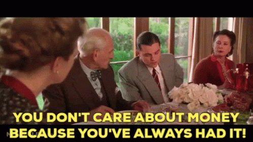 A Group Of People Sitting Around A Table With The Words You Don 'T Care About Money GIF