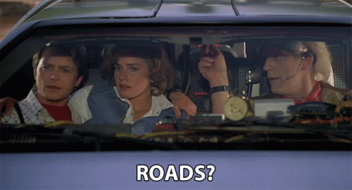 a group of people sitting in a car with the words roads written on the side
