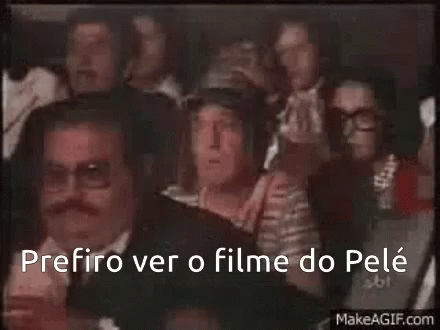 A Group Of People Sitting In A Dark Room With The Words " Prefero Ver O Filme Do Pele " GIF