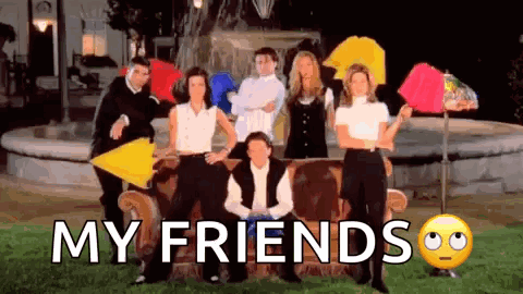 A Group Of People Sitting On A Couch With Umbrellas In Front Of A Fountain With The Words `` My Friends '' . GIF