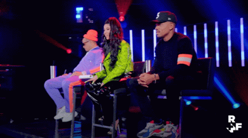 A Group Of People Sitting On A Stage With The Letters Rf On The Bottom GIF