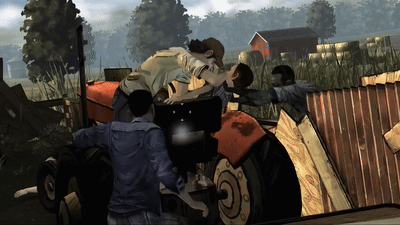 a group of people standing around a tractor that has the letter o on the front