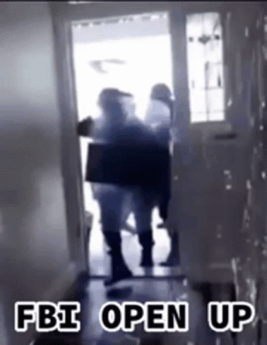 A Group Of People Standing In A Doorway With The Words Fbi Open Up Written On The Bottom . GIF