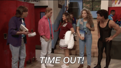 A Group Of People Standing In A Hallway With The Words Time Out Written On The Floor GIF