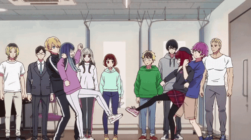 A Group Of People Standing In A Room With One Girl Holding Another Girl 'S Leg GIF