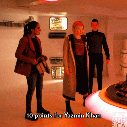 A Group Of People Standing In A Room With The Words " 10 Points For Yazmin Khan " On The Bottom GIF