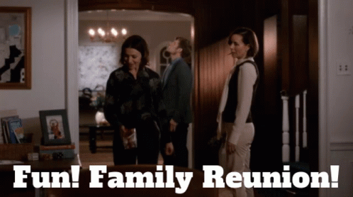 A Group Of People Standing In A Room With The Words Fun Family Reunion GIF