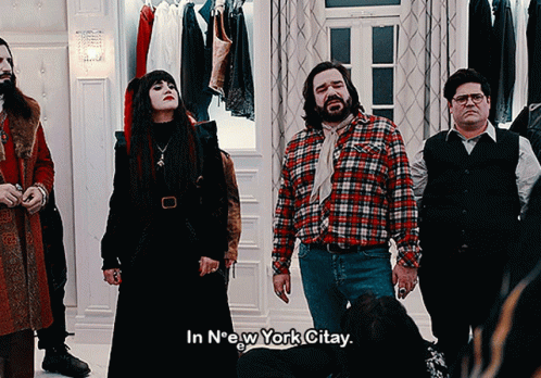 A Group Of People Standing In A Room With The Words In New York Citay On The Bottom GIF