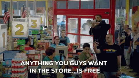 A Group Of People Standing In A Store With The Words Anything You Guys Want In The Store Is Free GIF