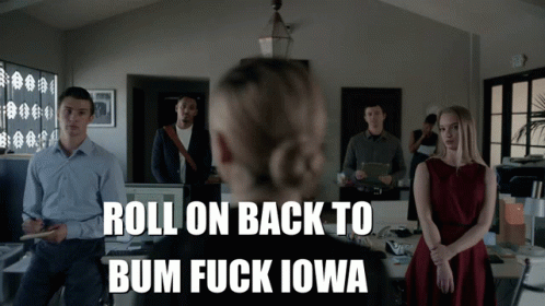 a group of people standing in an office with the words roll on back to bum fuck iowa on the bottom