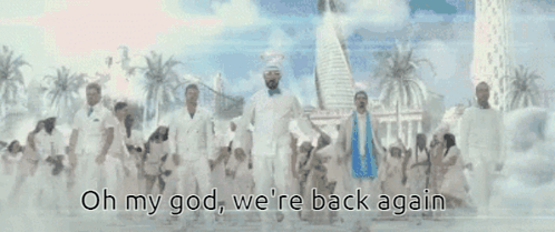 A Group Of People Standing In Front Of A City With The Words Oh My God We 'Re Back Again Written On The Bottom GIF