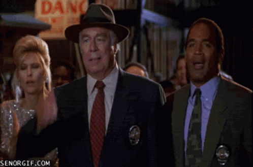 A Group Of People Standing In Front Of A Dang Sign GIF