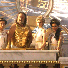 a group of people standing in front of a marble table