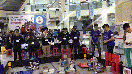A Group Of People Standing In Front Of A Sign That Says 2018 First Ftc GIF