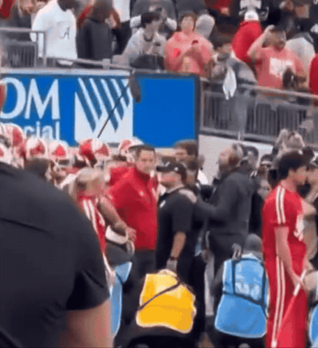 A Group Of People Standing In Front Of A Sign That Says Dm Social GIF