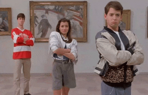 A Group Of People Standing In Front Of Paintings With The Words Deal With It In The Corner GIF
