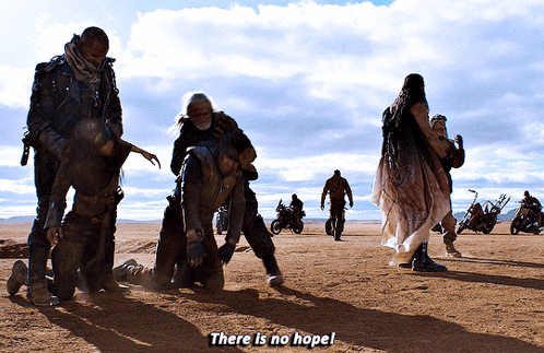 A Group Of People Standing In The Desert With The Words " There Is No Hope " GIF