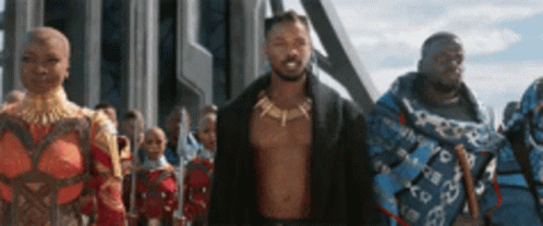A Group Of People Standing Next To Each Other In A Line . GIF