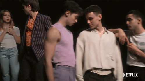 A Group Of People Standing Next To Each Other With Netflix Written On The Bottom Right GIF