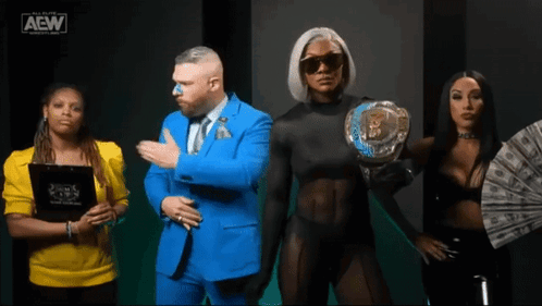A Group Of People Standing Next To Each Other With The Aew Logo On The Bottom GIF