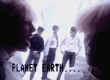 A Group Of People Standing Next To Each Other With The Words Planet Earth Written On The Bottom GIF