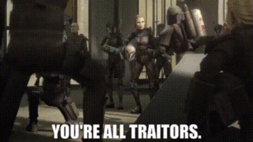A Group Of People Standing Next To Each Other With The Words `` You 'Re All Traitors '' Written On The Screen . GIF