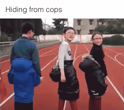 A Group Of People Standing On A Track With The Words Hiding From Cops Below Them GIF