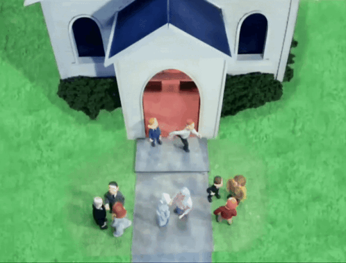 A Group Of People Standing Outside Of A White Church GIF