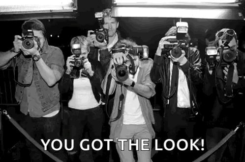 A Group Of People Taking Pictures With Their Cameras With The Caption " You Got The Look " Above Them GIF