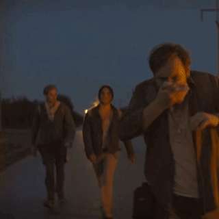 A Group Of People Walking Down A Street With One Wearing A T-Shirt That Says ' I Love You ' On It GIF