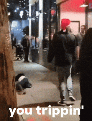 A Group Of People Walking Down A Street With The Words You Trippin ' On The Bottom Right GIF