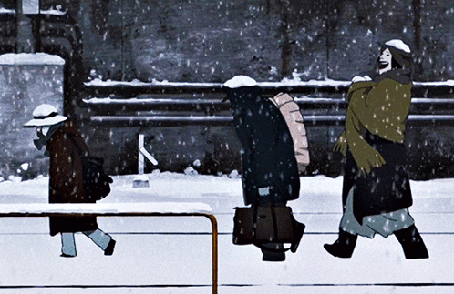 A Group Of People Walking In The Snow With The Letter K Visible In The Background GIF