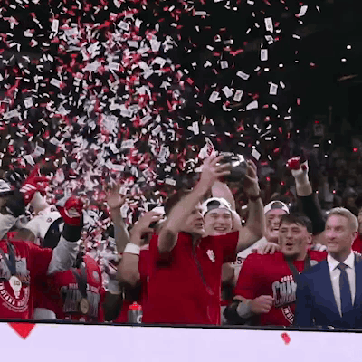A Group Of People Wearing Red Shirts That Say Texas GIF