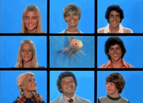 A Group Of People With A Fish In The Middle GIF
