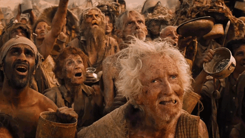 A Group Of People With Their Mouths Open Including An Elderly Man With Gray Hair GIF
