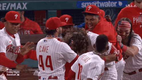 A Group Of Philadelphia Phillies Baseball Players Celebrate A Win GIF