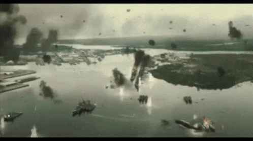 A Group Of Planes Are Flying Over A Body Of Water .. GIF