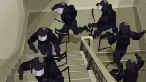 A Group Of Police Officers Are Running Down The Stairs . GIF