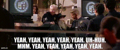 a group of police officers are standing in front of a sign that says yeah yeah yeah