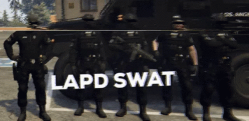 A Group Of Police Officers Standing In Front Of A Vehicle That Says Lapd Swat On It GIF