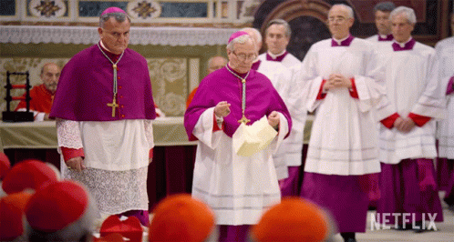 A Group Of Priests Are Standing In A Church With A Netflix Logo Behind Them GIF