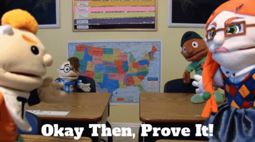 A Group Of Puppet Characters In A Classroom With The Words " Okay Then Prove It " Above Them GIF