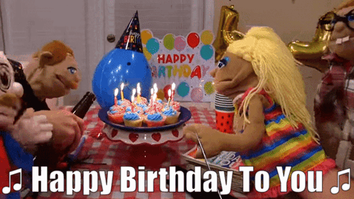 A Group Of Puppets Are Celebrating A Birthday GIF