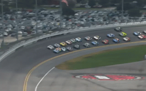 a group of race cars are lined up on a race track