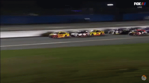 A Group Of Race Cars Are Racing On A Track Sponsored By Fox Live GIF